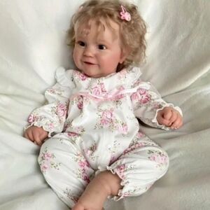 Charming Floral Reborn Baby in White and Pink. She Is 20 Inches Tall.